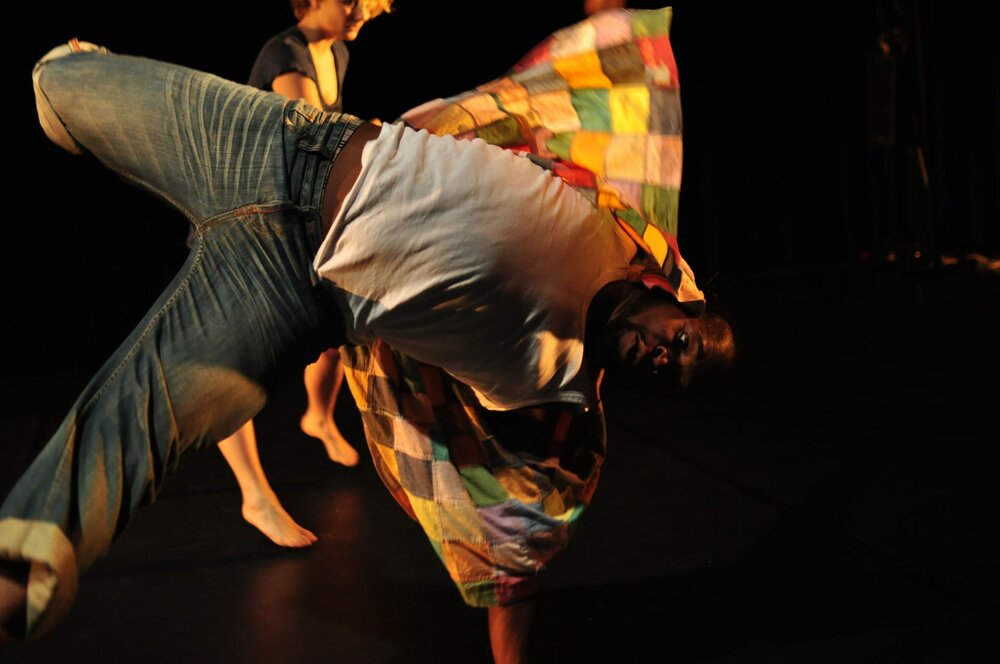 Two people dancing, one is in the foreground